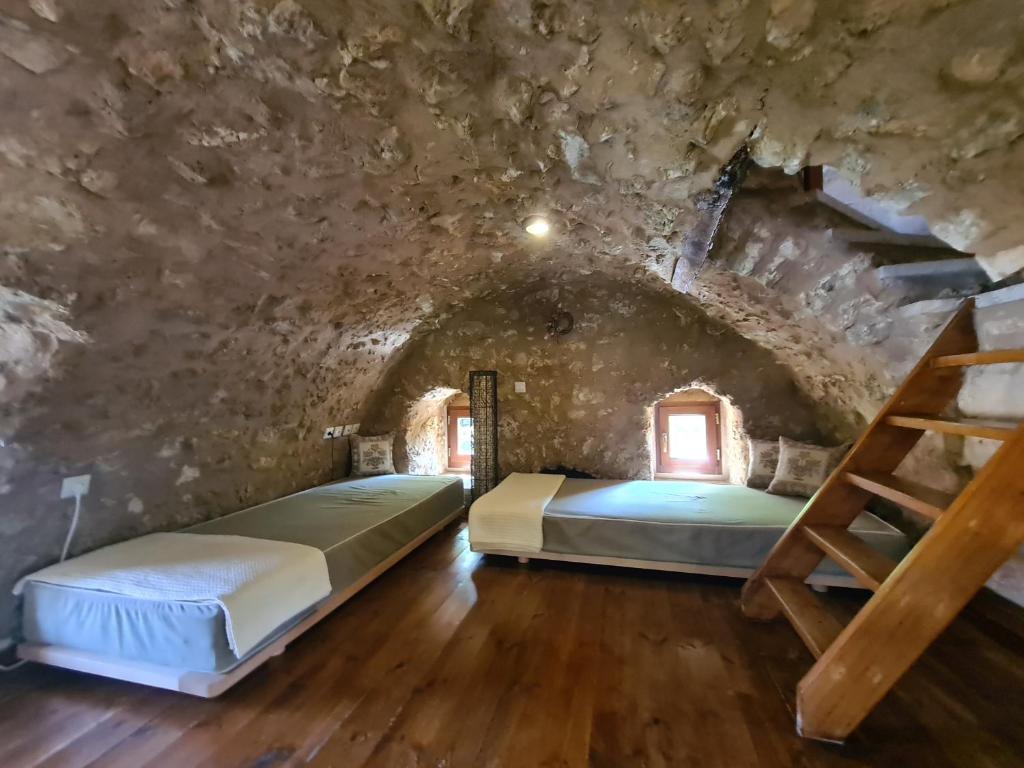 Postel nebo postele na pokoji v ubytování Pyrgos 1869
