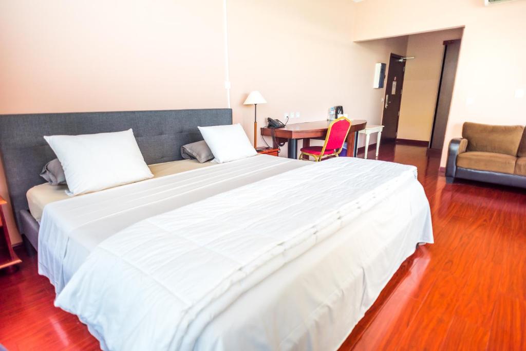 Postel nebo postele na pokoji v ubytování Hotel Sarah Nui