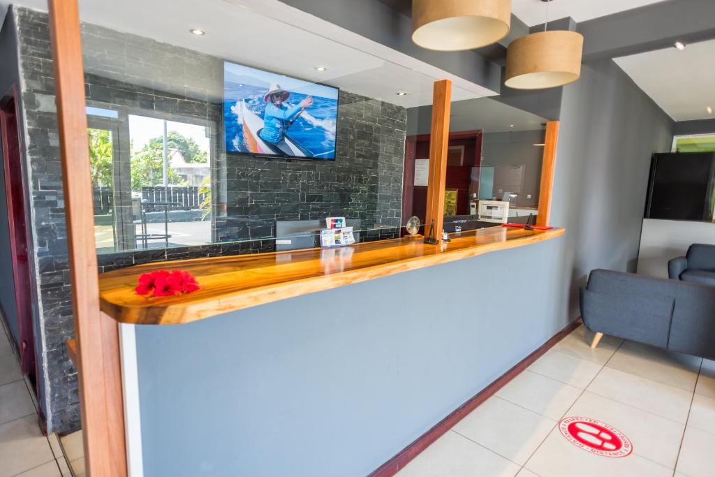 TV a/nebo společenská místnost v ubytování Hotel Sarah Nui