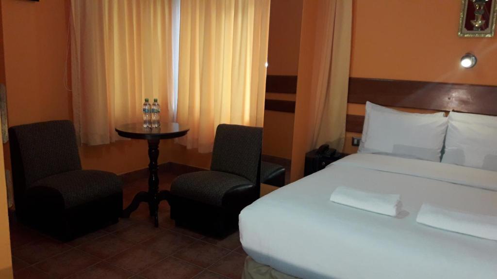 Postel nebo postele na pokoji v ubytování Hotel Rio Dorado MachuPicchu