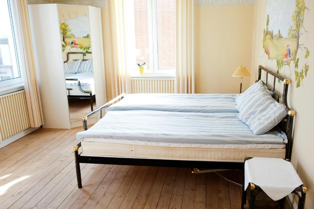 Postel nebo postele na pokoji v ubytování Reftele Wardshus