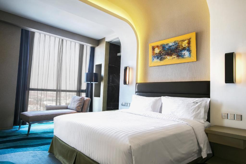 Postel nebo postele na pokoji v ubytování Holiday Inn Shanghai Songjiang by IHG - Miaoqian Street