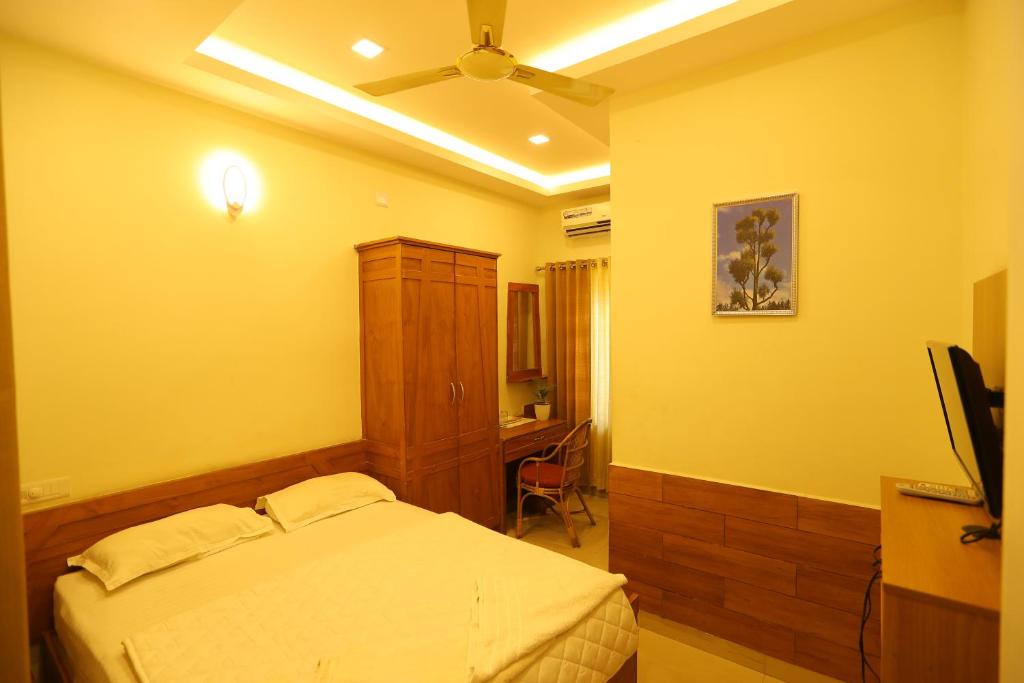 Postel nebo postele na pokoji v ubytování SAPPHIRE INN