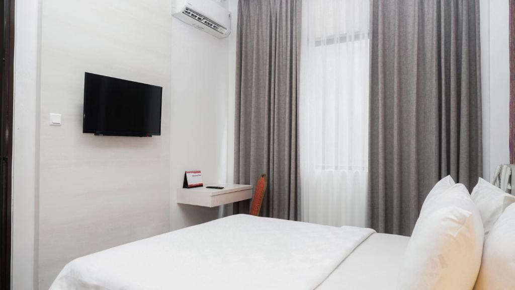 TV a/nebo společenská místnost v ubytování Alam Hotel by Cordela