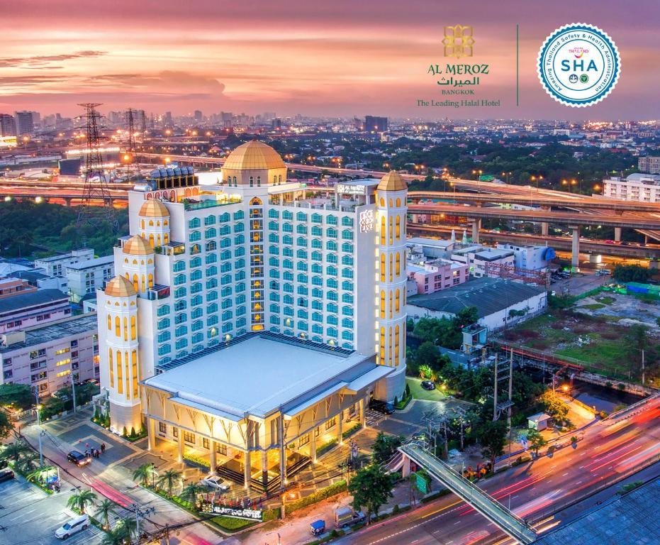 an amazing view of a building in a city at night at Al Meroz Hotel Bangkok - The Leading Halal Hotel in Bangkok