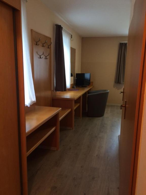 TV a/nebo společenská místnost v ubytování Hotel Zsida