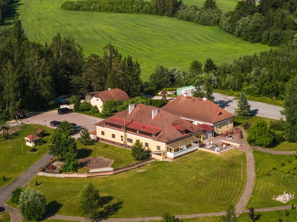 an aerial view of a large house with a yard at Ruunawere Hotel in Nõmmealuse