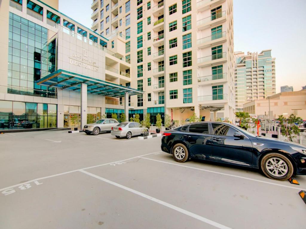 a car parked in a parking lot in front of a building at OYO 619 Home 1308 , DEC Tower in Dubai