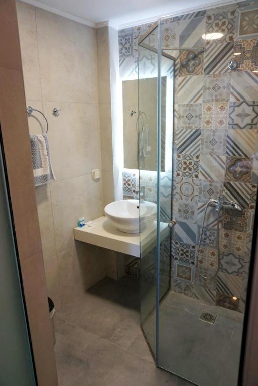 Koupelna v ubytování Poseidon Hotel