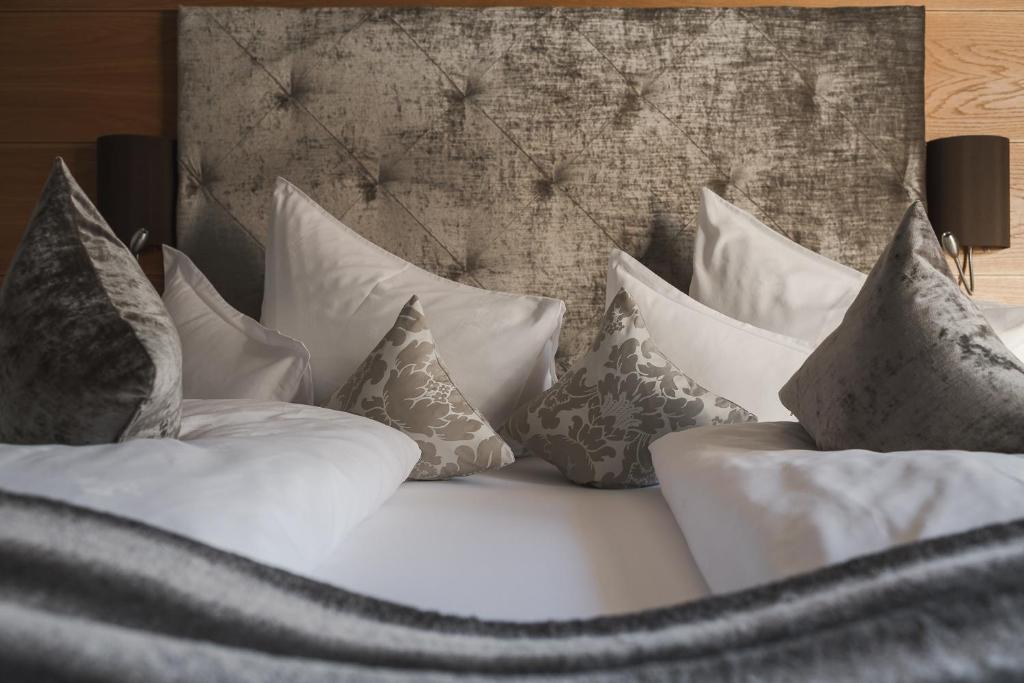 Postel nebo postele na pokoji v ubytování Garni Hotel Platzer