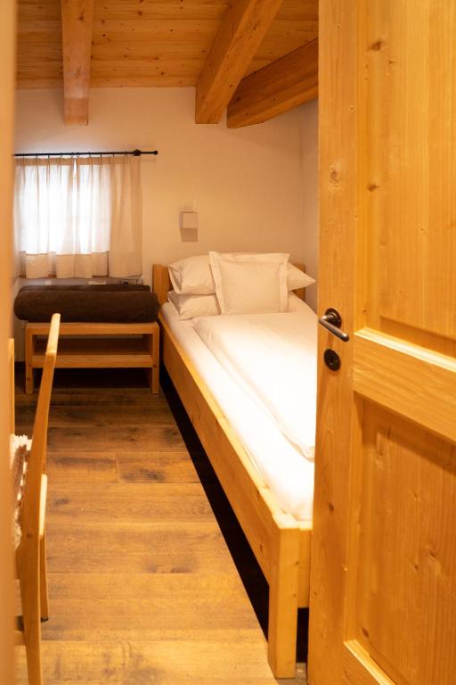 A bed or beds in a room at Chalet Corvara