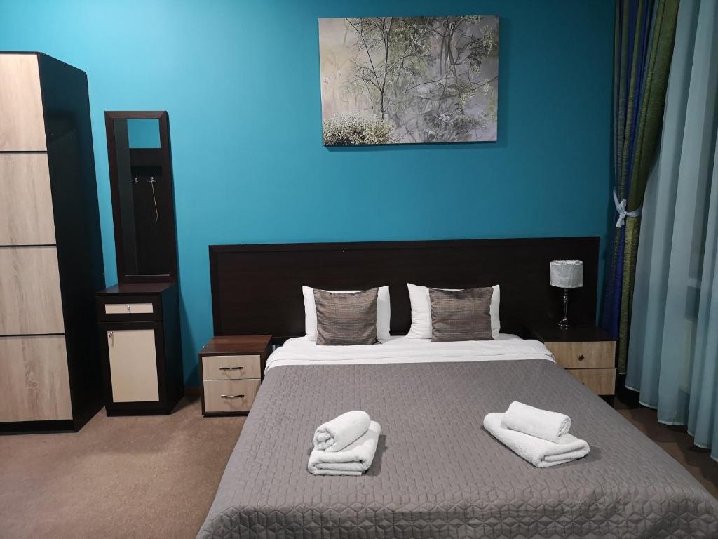 Postel nebo postele na pokoji v ubytování Orange Hotel