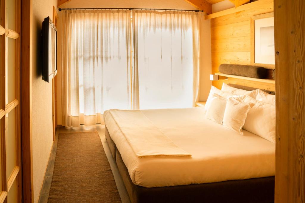 A bed or beds in a room at Chalet Corvara