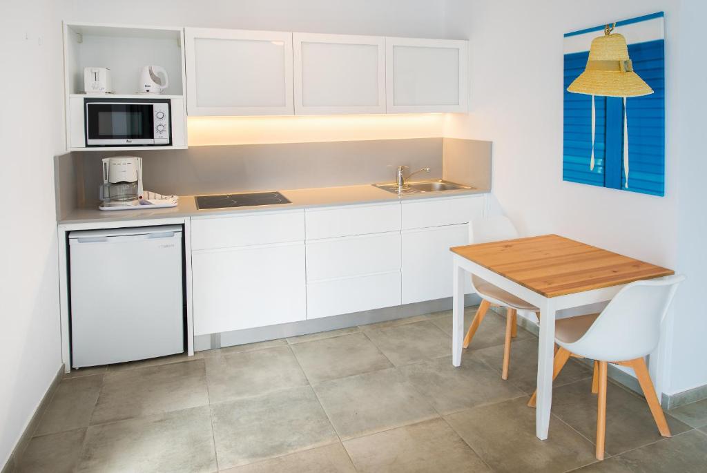 Kuchyň nebo kuchyňský kout v ubytování Apartamentos Playamar