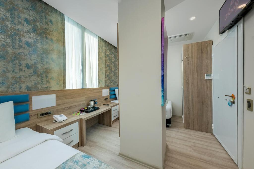 Postel nebo postele na pokoji v ubytování Anelli Hotel