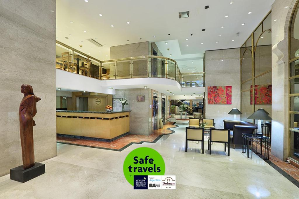 a lobby of a building with a statue of a woman at Hotel Dolmen in Buenos Aires