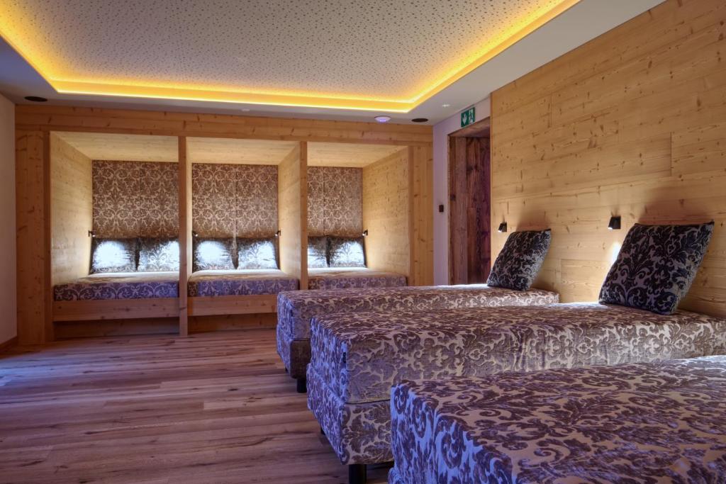 Postel nebo postele na pokoji v ubytování Bonfanti Design Hotel