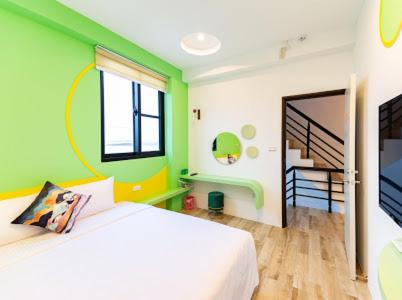 Postel nebo postele na pokoji v ubytování Haipai Sweetheart Homestay
