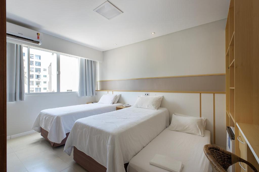 Cama ou camas em um quarto em Miramar Hotel