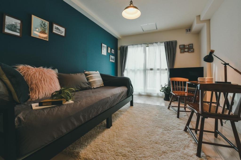 a living room with a couch and a table at Florish 67 - Vacation STAY 15424v in Sapporo