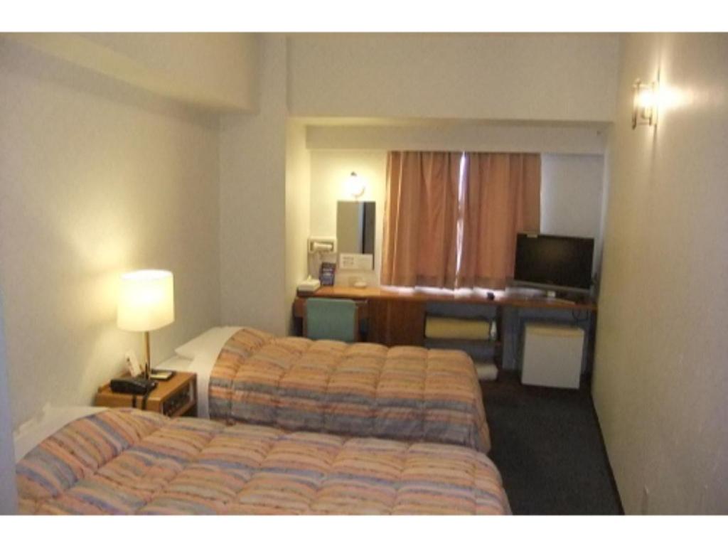 מיטה או מיטות בחדר ב-Hotel Kokusai Plaza - Vacation STAY 09934v