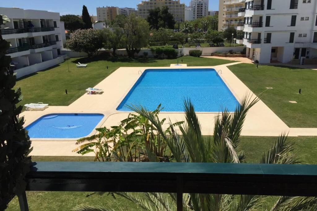 a view of a swimming pool from a building at Marina Mar in Vilamoura downtown in Quarteira