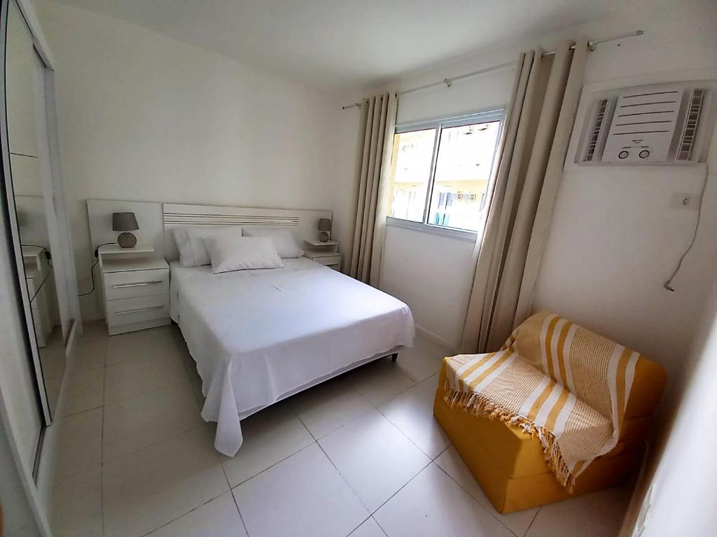 A bed or beds in a room at Apartamento com vista pro mar e acesso privativo à praia!