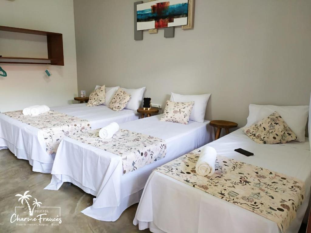 Ένα ή περισσότερα κρεβάτια σε δωμάτιο στο Pousada Charme Francês