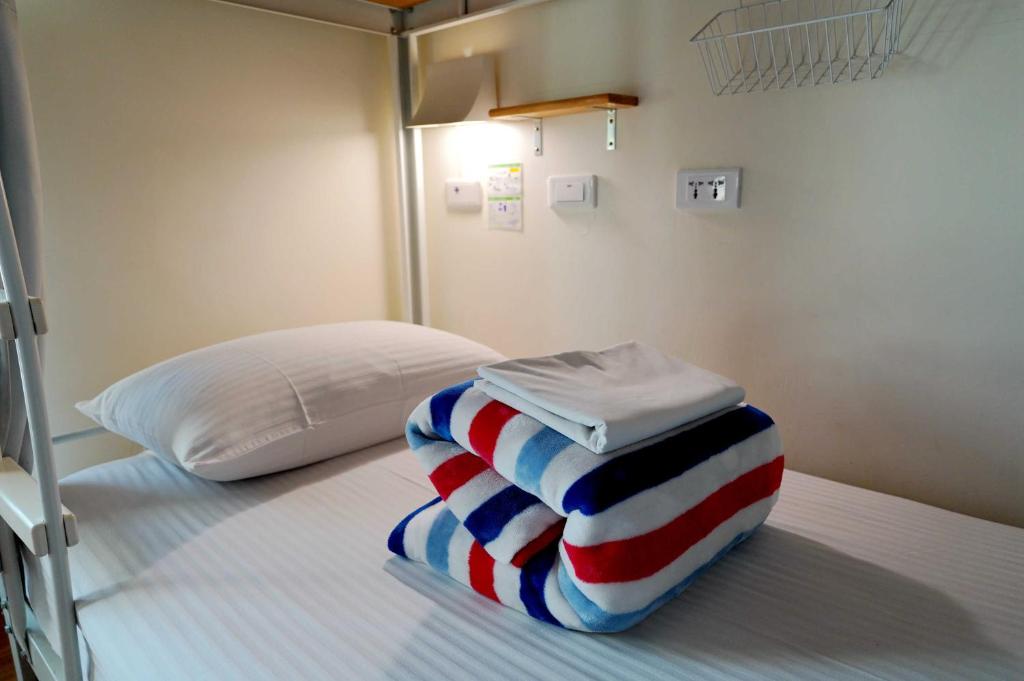 Postel nebo postele na pokoji v ubytování 安蘭居旅店 An Lan Jie Hotel