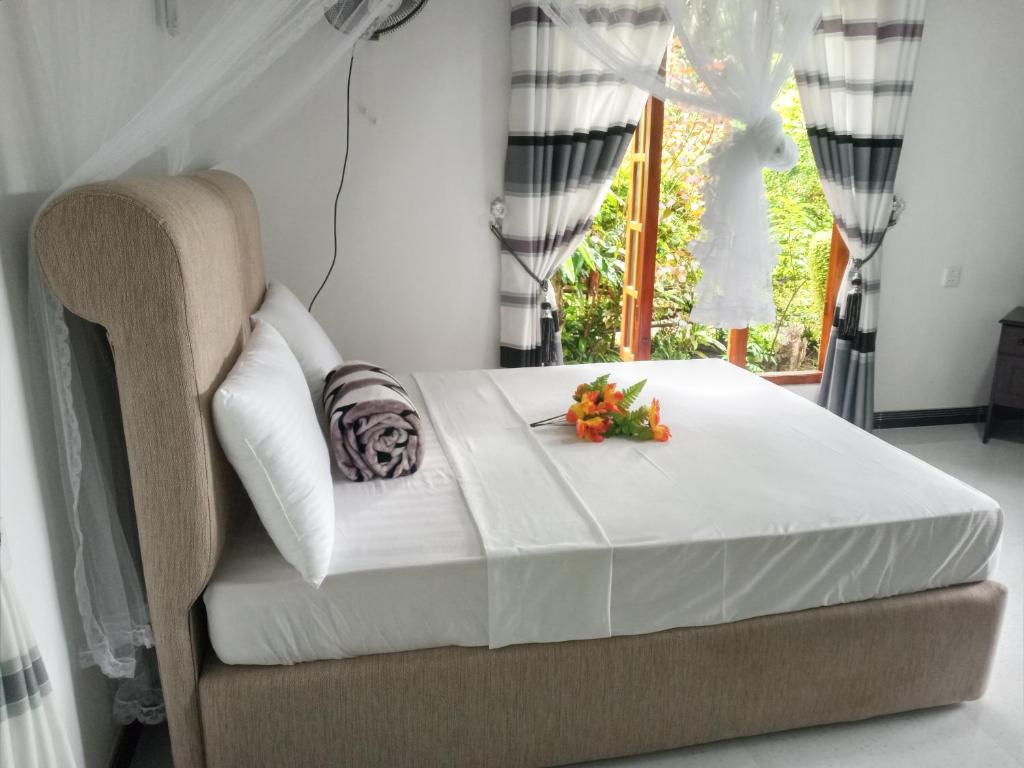 Postel nebo postele na pokoji v ubytování Mellow Homestay