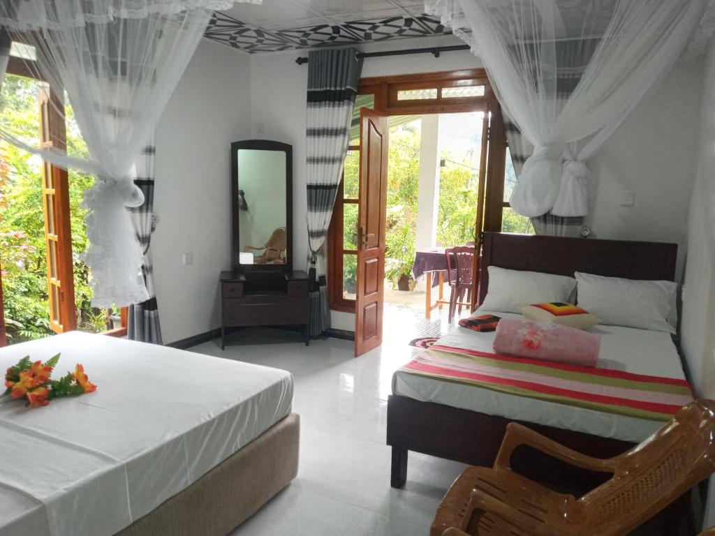 Postel nebo postele na pokoji v ubytování Mellow Homestay