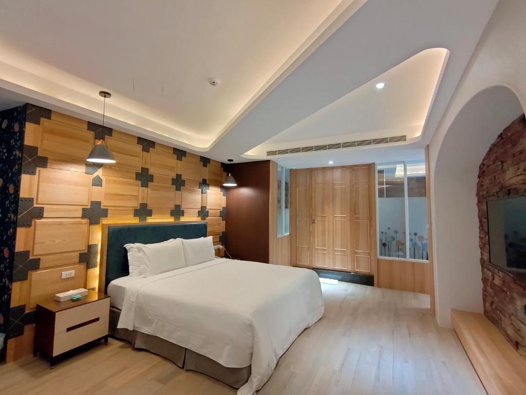 Postel nebo postele na pokoji v ubytování 浪琴Motel文創旅館