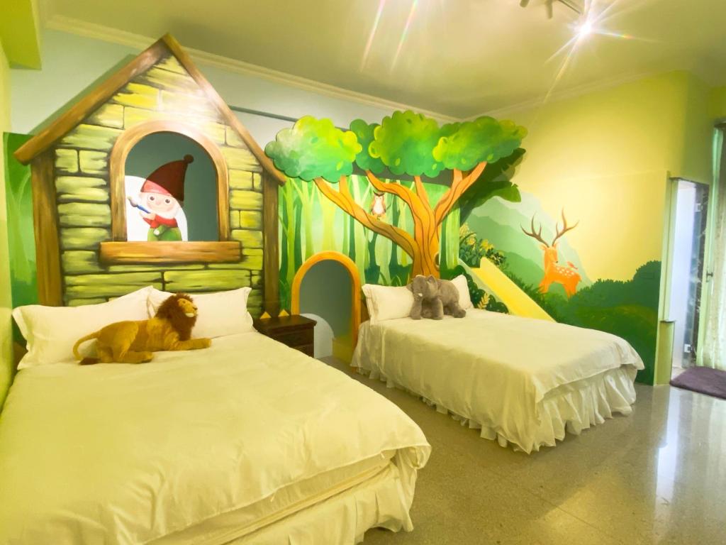 a bedroom with two beds with a tree and a house at Hualien Lidu House in Hualien City