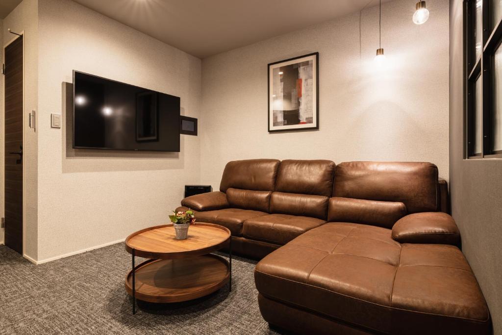 TV a/nebo společenská místnost v ubytování GRAND BASE Hakata Premium