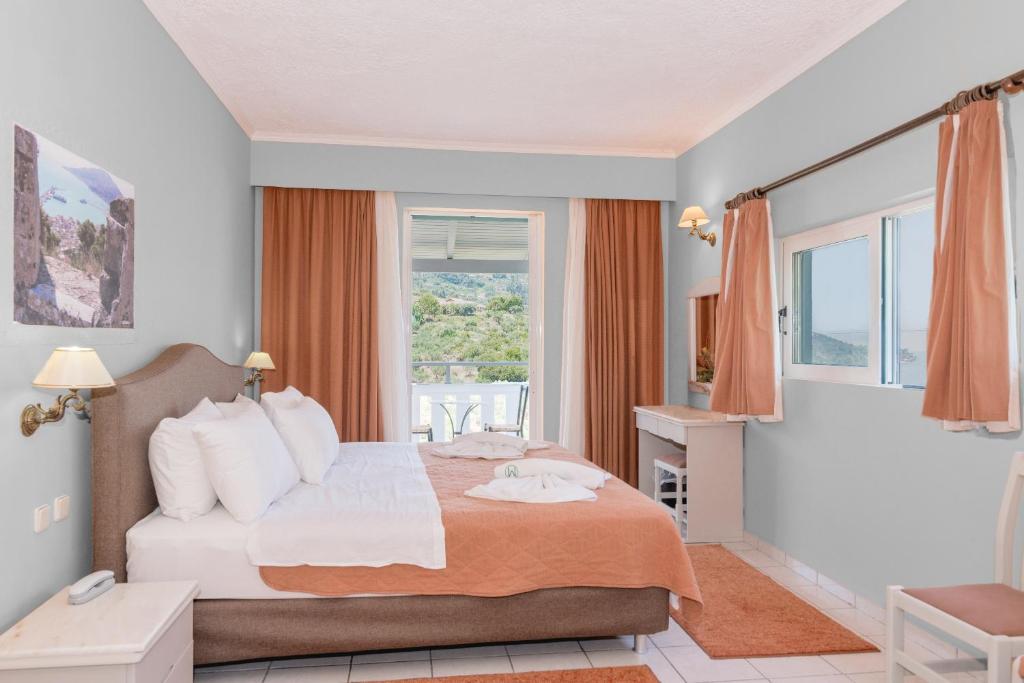 Postel nebo postele na pokoji v ubytování Matilda Hotel