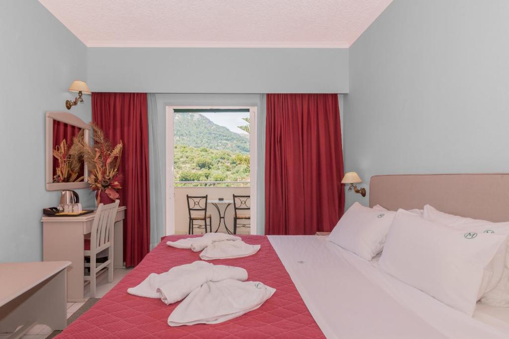 Postel nebo postele na pokoji v ubytování Matilda Hotel