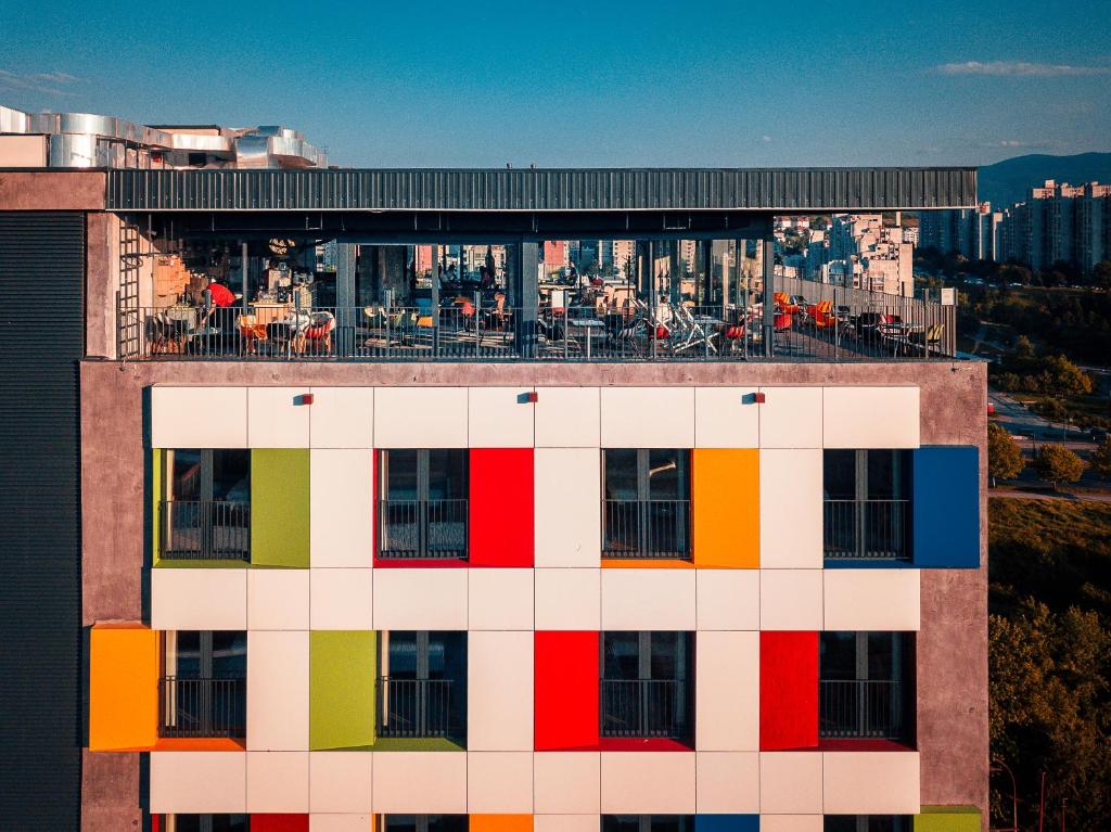 a building with colored squares on the top of it at ibis Styles Sarajevo in Sarajevo