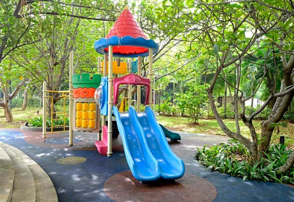a playground with a slide in a park at Discovery Ancol in Jakarta