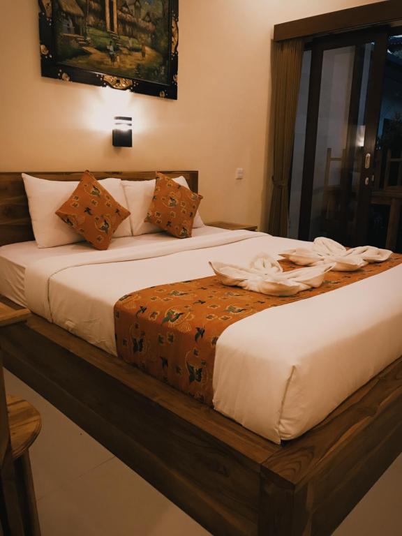 Postel nebo postele na pokoji v ubytování Kubu Loris Residence