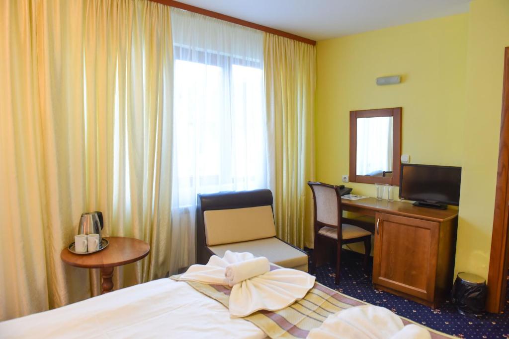 Postel nebo postele na pokoji v ubytování Family Hotel Lazur