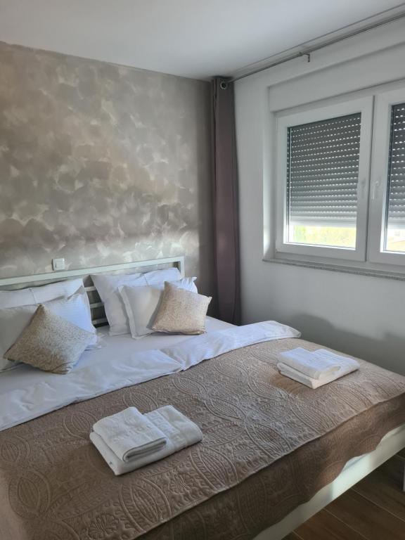 Postel nebo postele na pokoji v ubytování Villa Maris Nin