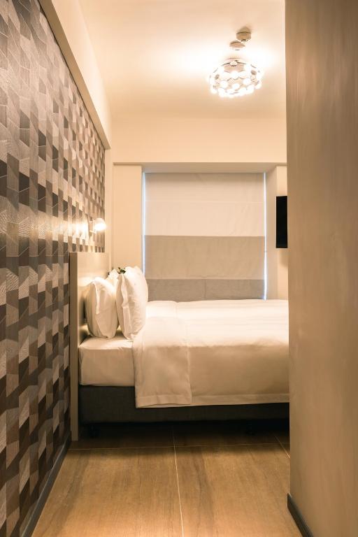 Postel nebo postele na pokoji v ubytování City Inn Macau