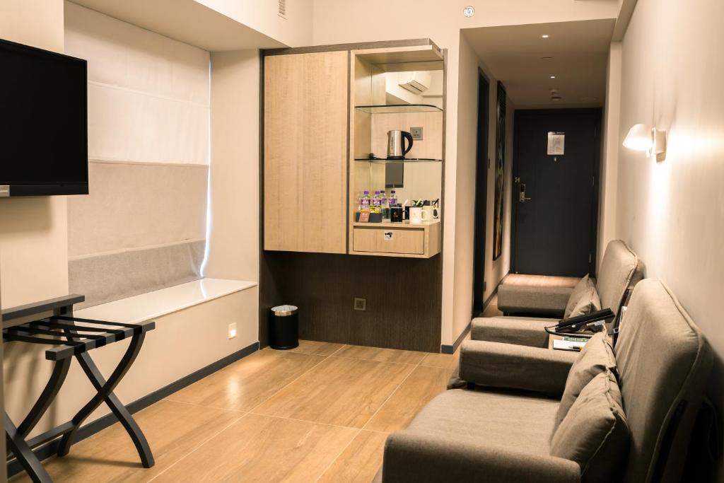 TV a/nebo společenská místnost v ubytování City Inn Macau