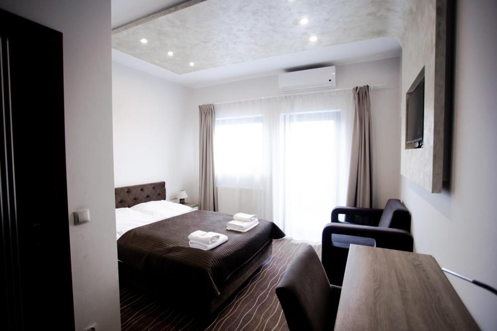 Postel nebo postele na pokoji v ubytování Hotel Wena
