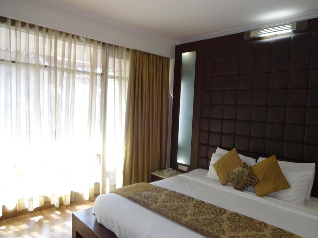 Postel nebo postele na pokoji v ubytování Hotel Combermere