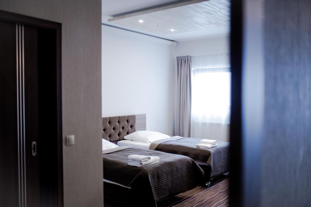 Postel nebo postele na pokoji v ubytování Hotel Wena