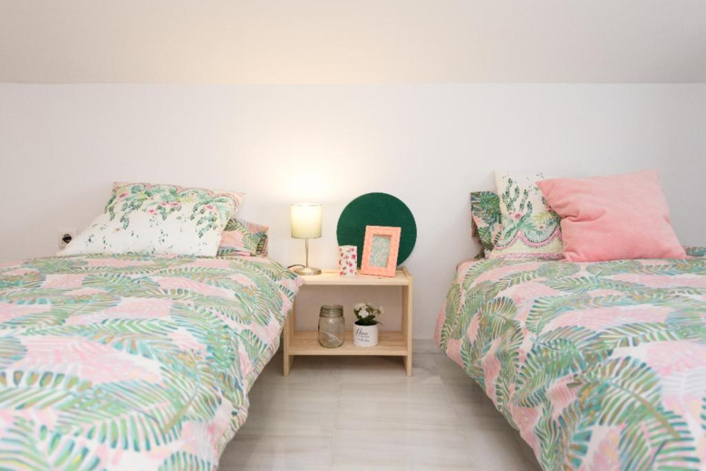 Łóżko lub łóżka w pokoju w obiekcie Hygge Apartment Center Near to the beach Free Parking 2R