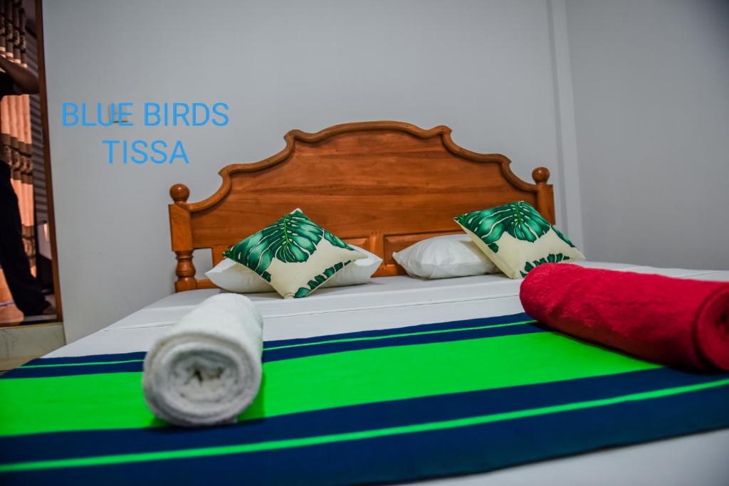 Postel nebo postele na pokoji v ubytování Blue Birds Tissa & Yala safari