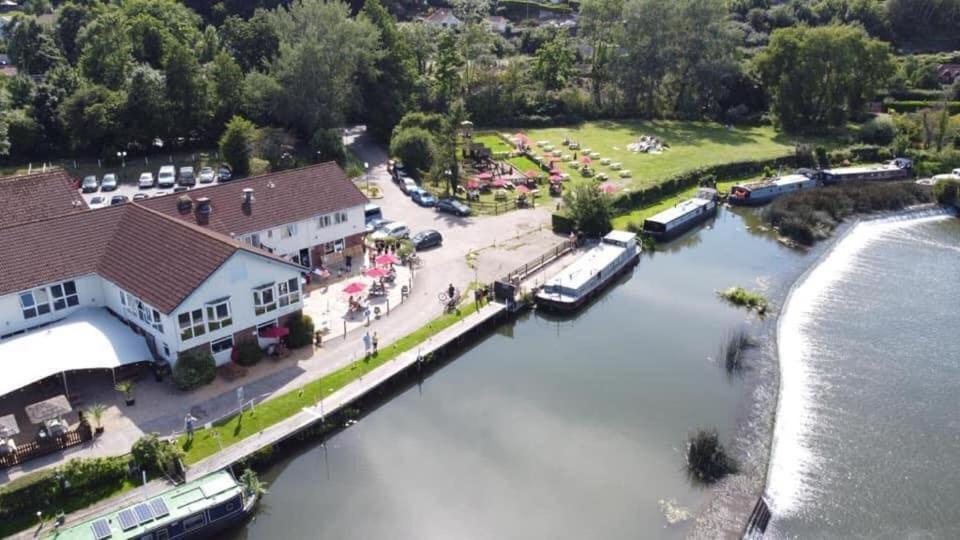 an aerial view of a marina with boats in the water at The Riverside inn in Saltford