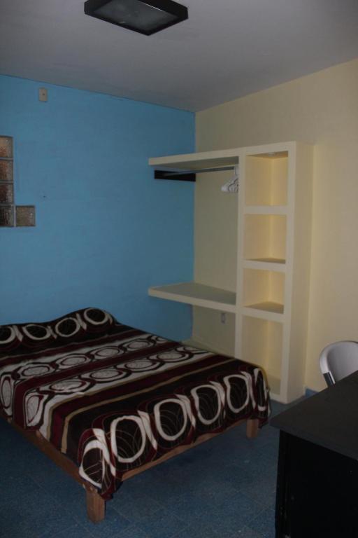 Postel nebo postele na pokoji v ubytování Posada de Vick